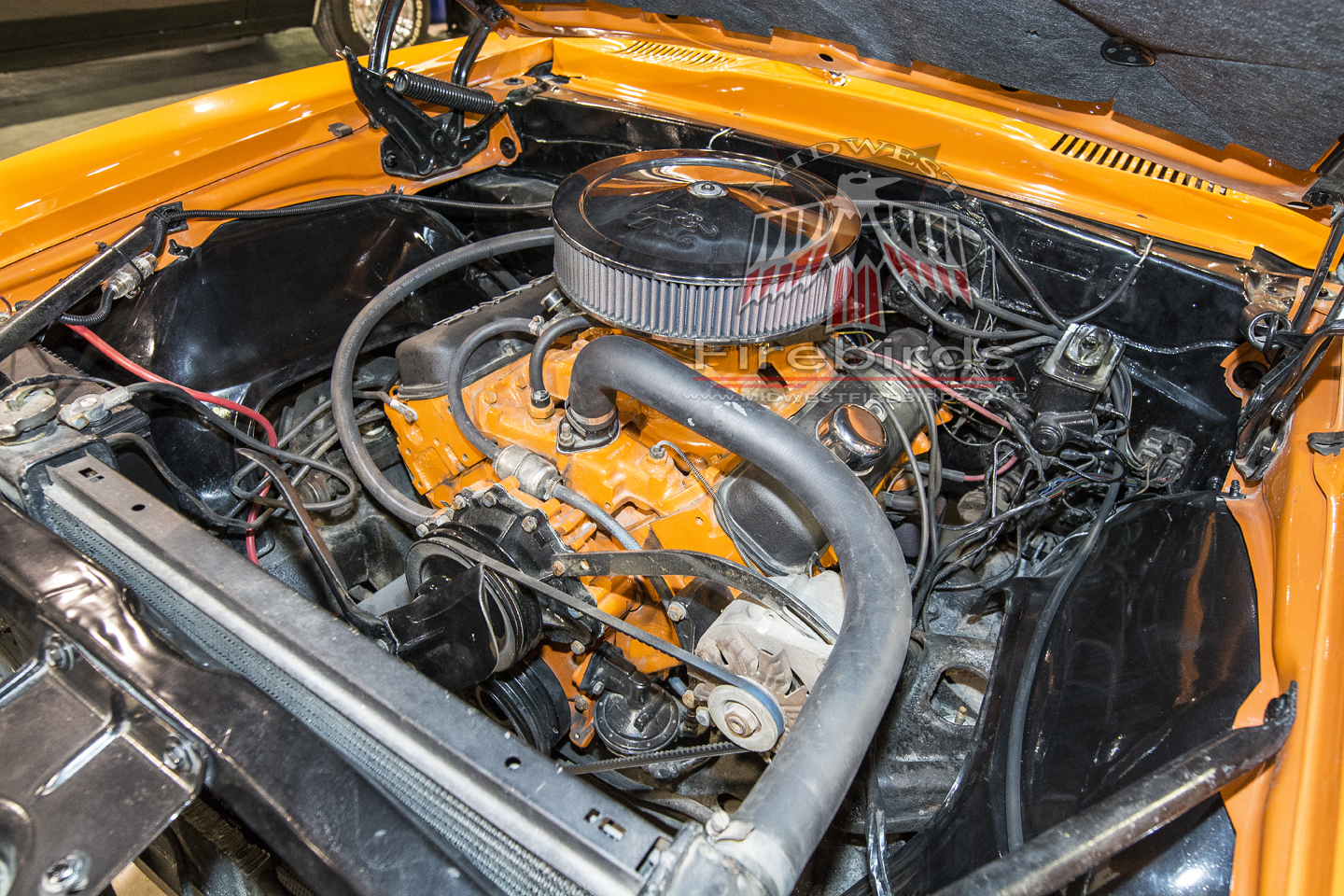 This orange 1967 Pontiac Firebird coupe was on display at the 2014 World of Wheels car show.
