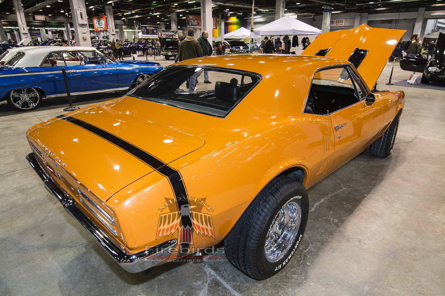 This orange 1967 Pontiac Firebird coupe was on display at the 2014 World of Wheels car show.